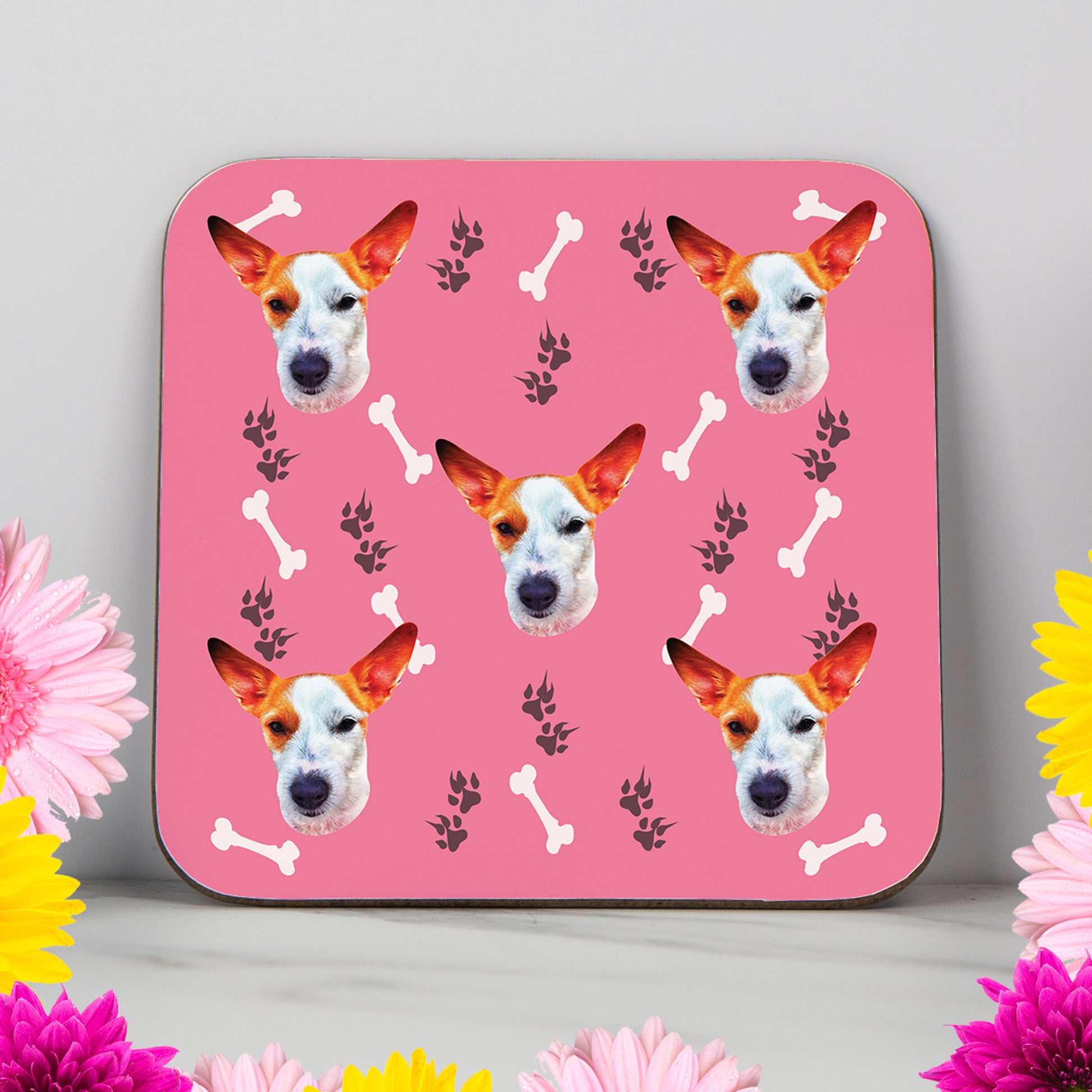 Custom dog photo coaster with repeating face design, colourful bone and paw print background. Personalised gift for dog lovers, dog mums, or pet owners. Glossy finish, perfect for birthdays, Christmas, or fun home decor.