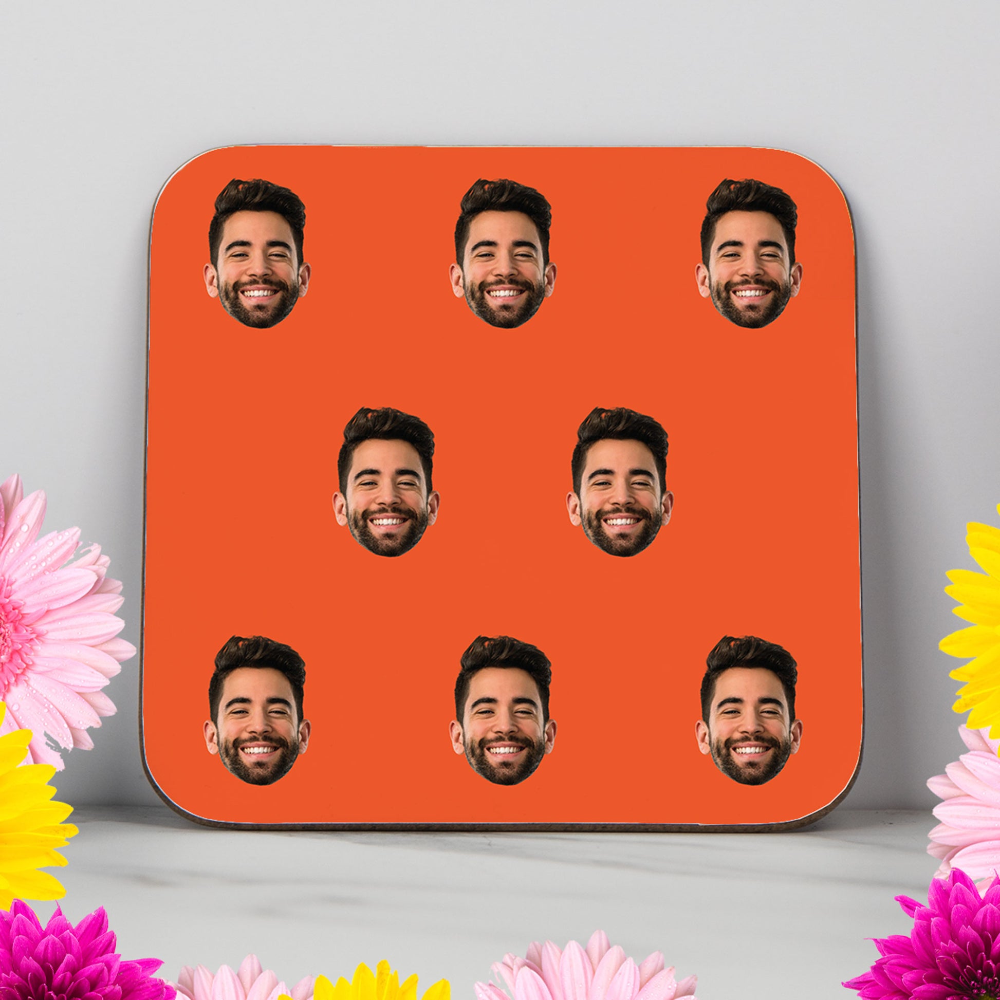 Custom coaster with repeating face pattern on a bold coloured background – personalised photo gift, fun and unique present for him or her