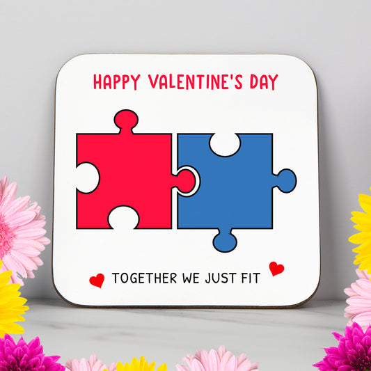 Valentine’s Day coaster with red and blue puzzle pieces and the phrase "Together We Just Fit." A unique romantic gift for couples, this cute and funny design is ideal for boyfriend, girlfriend, husband or wife. Perfect for anniversaries, Valentine's Day or romantic surprises. Add adorable Valentine’s decor to your home or gift a sweet keepsake to someone who completes you.