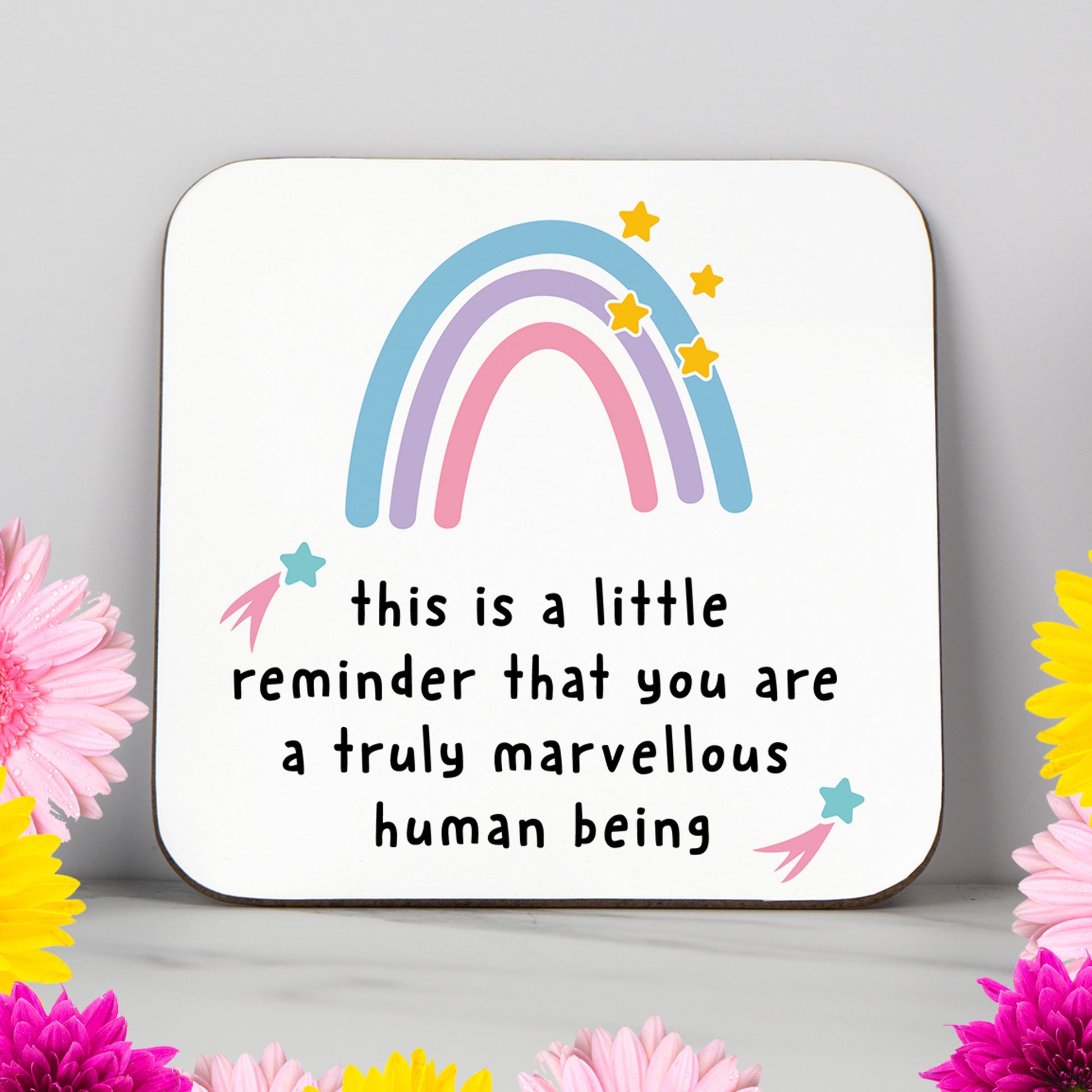 White coaster with a pastel rainbow and the message “This is a little reminder that you are a truly marvellous human being” – a thoughtful, positive gift for friends or loved ones.