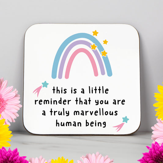 White coaster with a pastel rainbow and the message “This is a little reminder that you are a truly marvellous human being” – a thoughtful, positive gift for friends or loved ones.